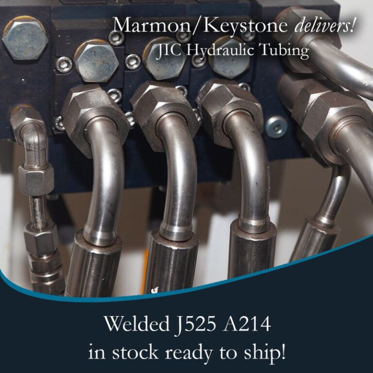 post-1-2 Marmon Keystone Close-up view of metal hydraulic tubes connected to fittings, highlighting Marmon/Keystone as your trusted metals distributor for JIC hydraulic tubing—welded J525 A214—available in stock and ready to ship for your supplychain needs.