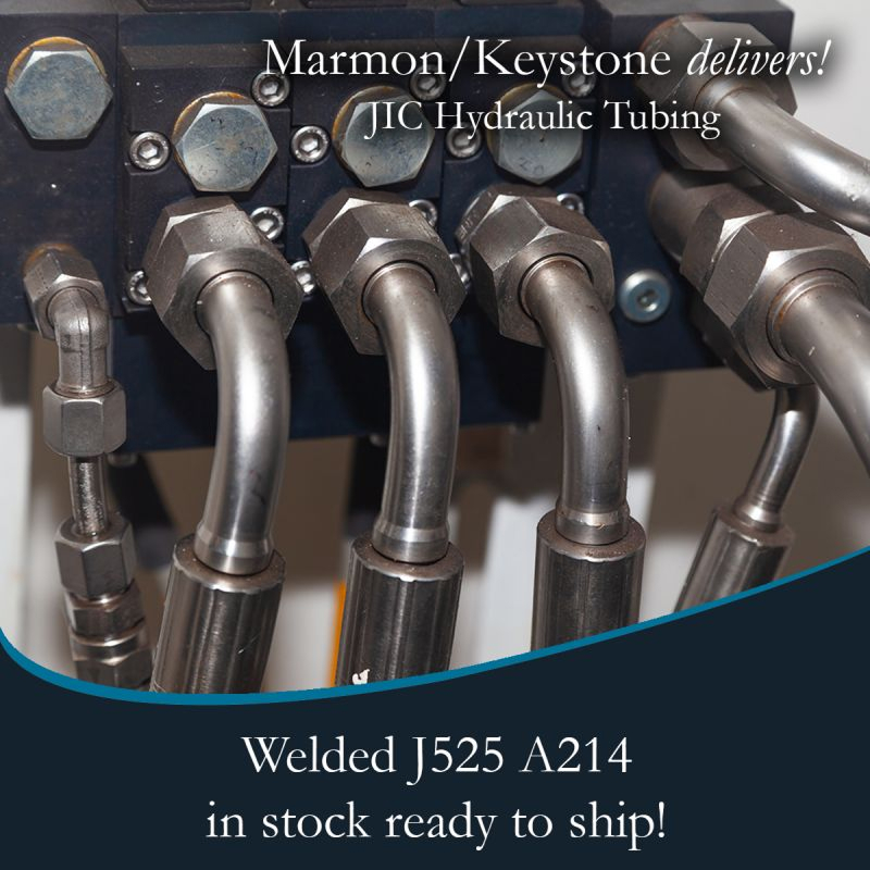 post-1-2 Marmon Keystone Close-up view of metal hydraulic tubes connected to fittings, highlighting Marmon/Keystone as your trusted metals distributor for JIC hydraulic tubing—welded J525 A214—available in stock and ready to ship for your supplychain needs.