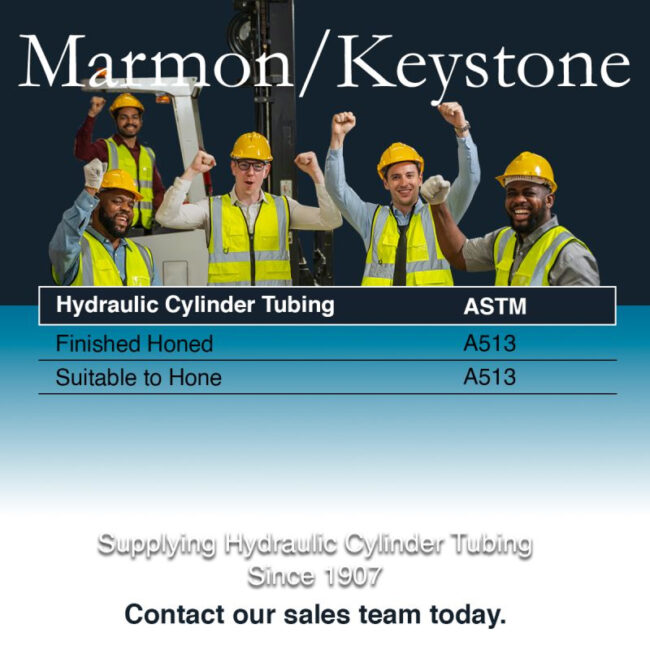 post-1-5 Marmon Keystone Five workers in safety vests and helmets stand before industrial equipment, raising their fists and smiling. Text below lists hydraulic cylinder tube and bar specifications and contact info for Marmon/Keystone, your trusted metals distributor.
