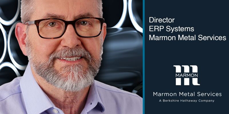 post-1-9 Marmon Keystone A man with glasses and a beard is smiling in front of a metallic, circular patterned background. Text reads: "Brad McQueen, Director ERP Systems, Marmon Metal Services—leading metals supply chain. Promotion earned! Marmon Metal Services logo included.